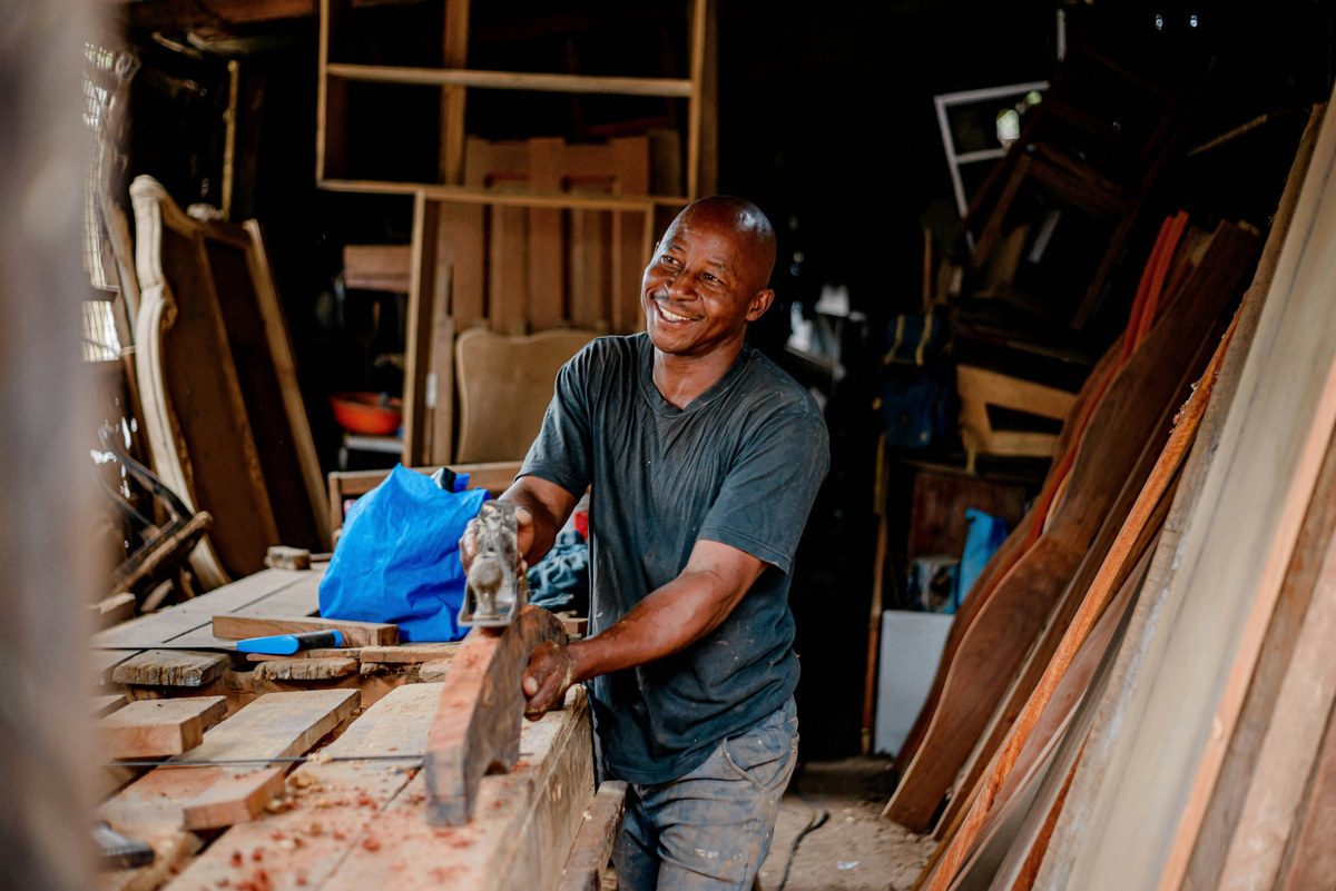 A South African furniture maker at work in his workshop